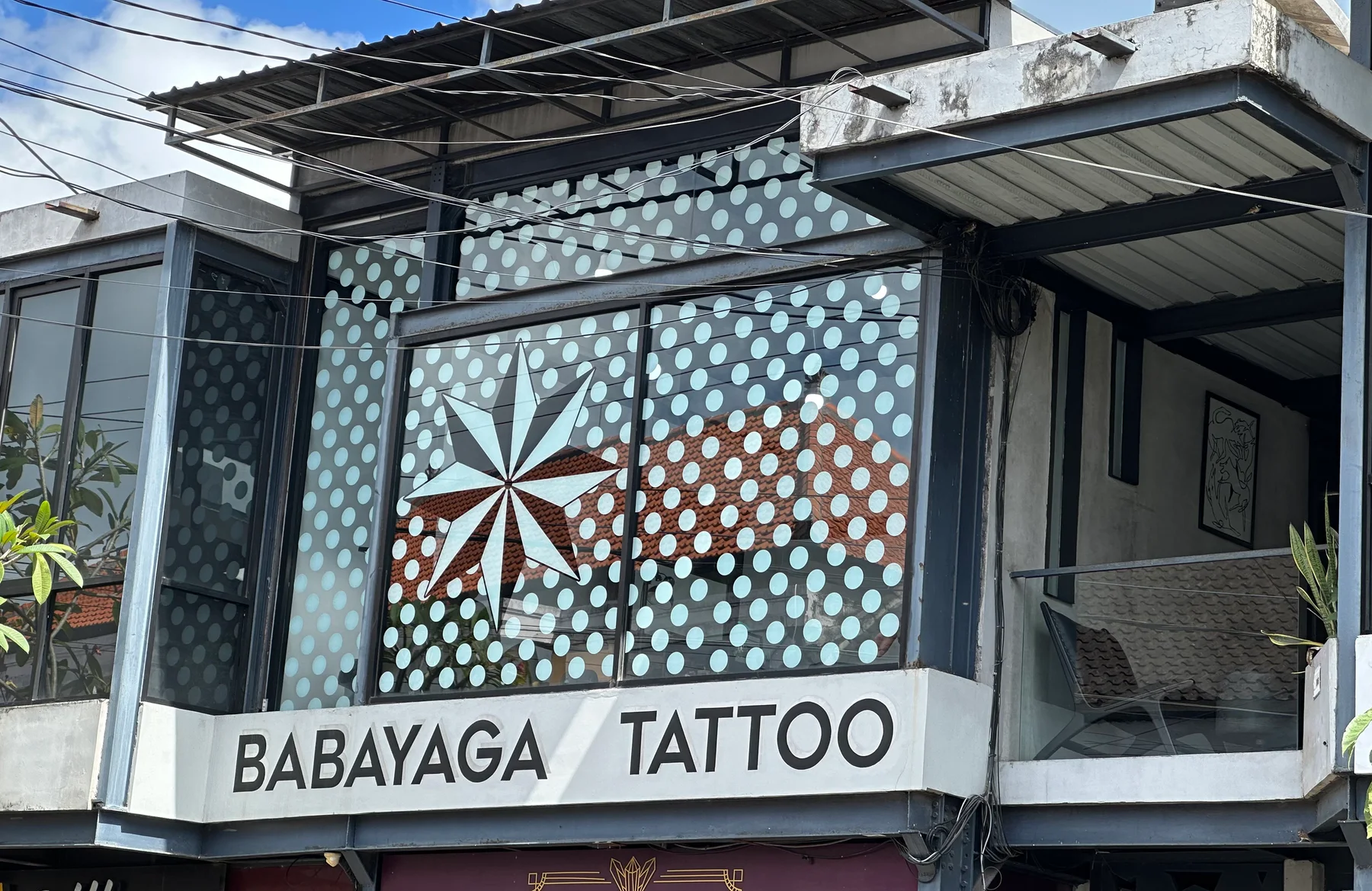 Wide studio photograph published by Babayaga Tattoo