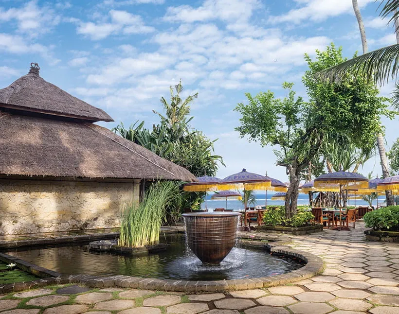 Open-air Frangipani Cafe dining area at The Oberoi Bali